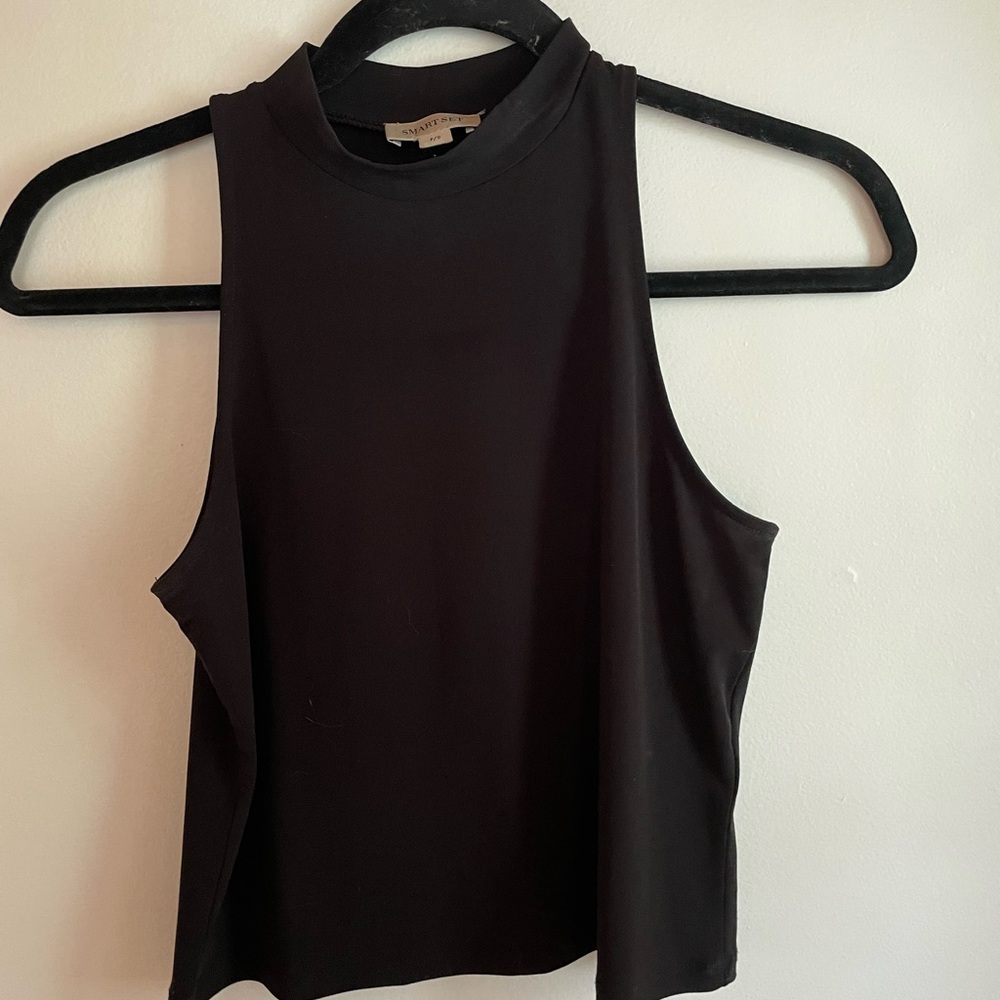 High neck black tank. Since small, smart set.